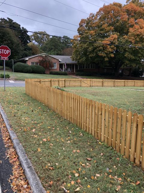 Wood privacy fence along a residential backyard