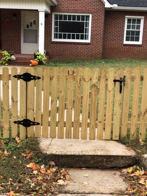 Board-on-board wood privacy fencing