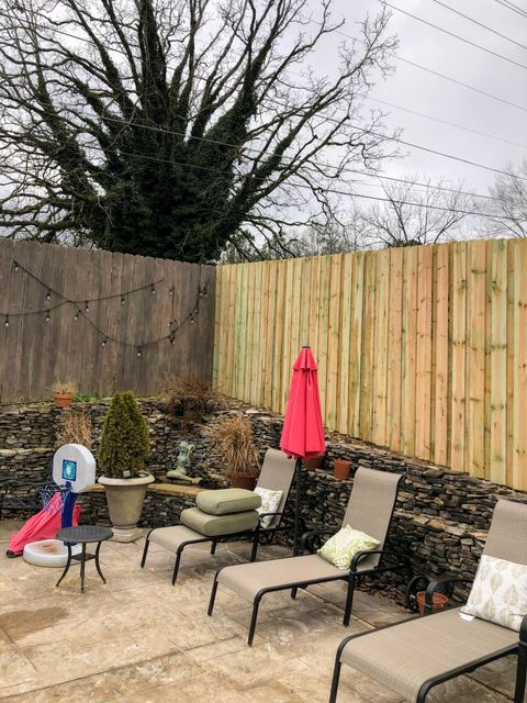Tall wood privacy fence with lattice top