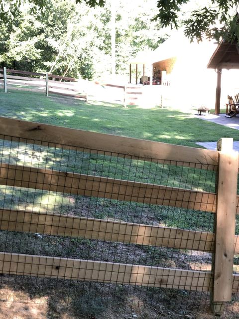 Three-rail wood farm fence