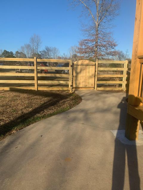 Modern horizontal wood fence with sliding gate