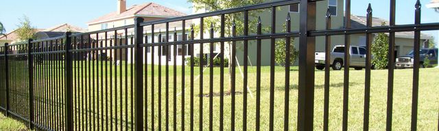 Ornamental steel fence with decorative finials