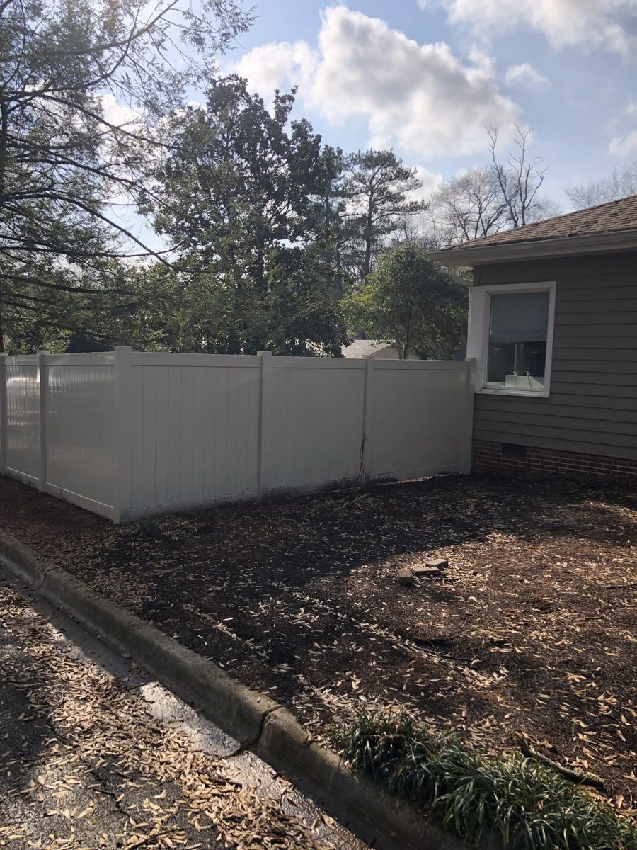 Custom wood driveway gate installed by Dalton Fence