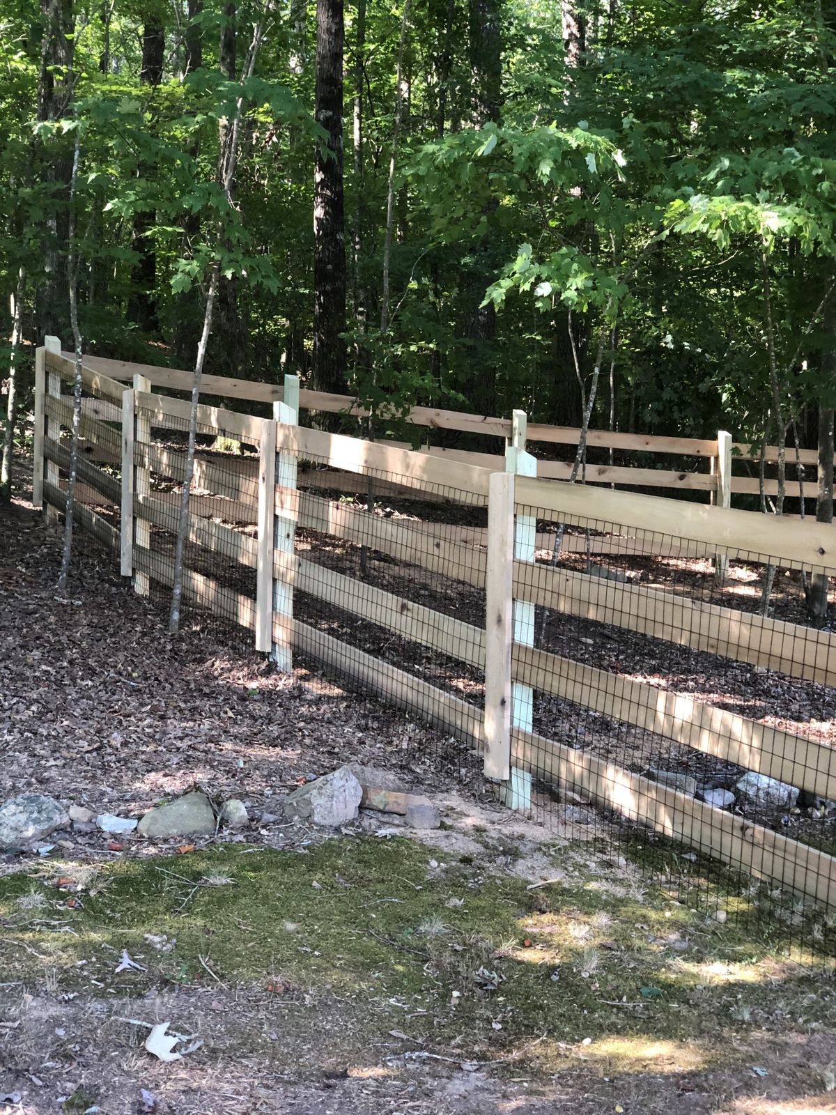 Custom wood privacy fence with decorative post caps